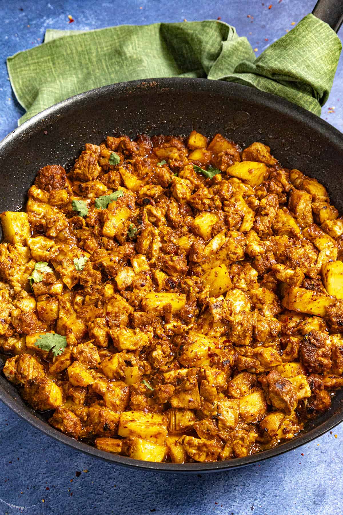 A panful of Chicken al Pastor on a table, ready to be served.