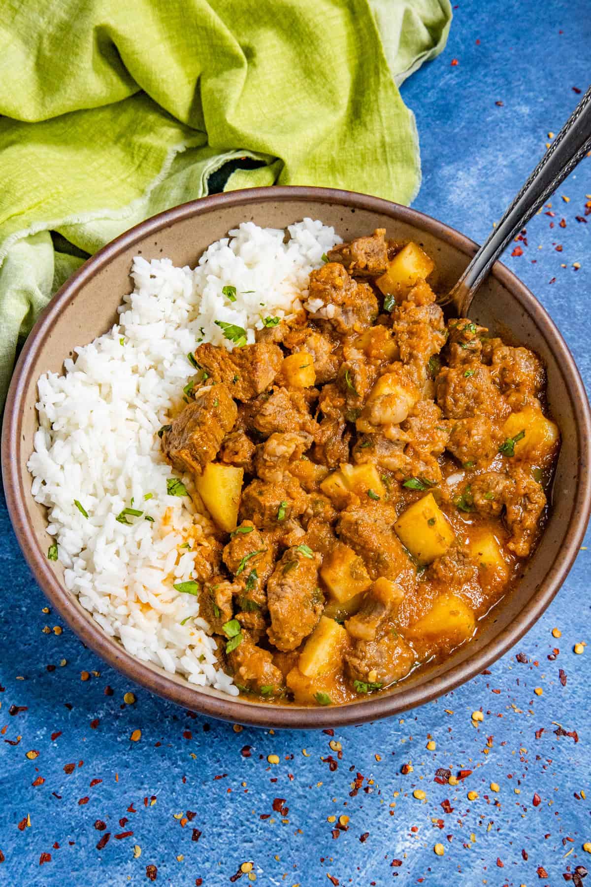 Carne con Papas served in a bowl with rice