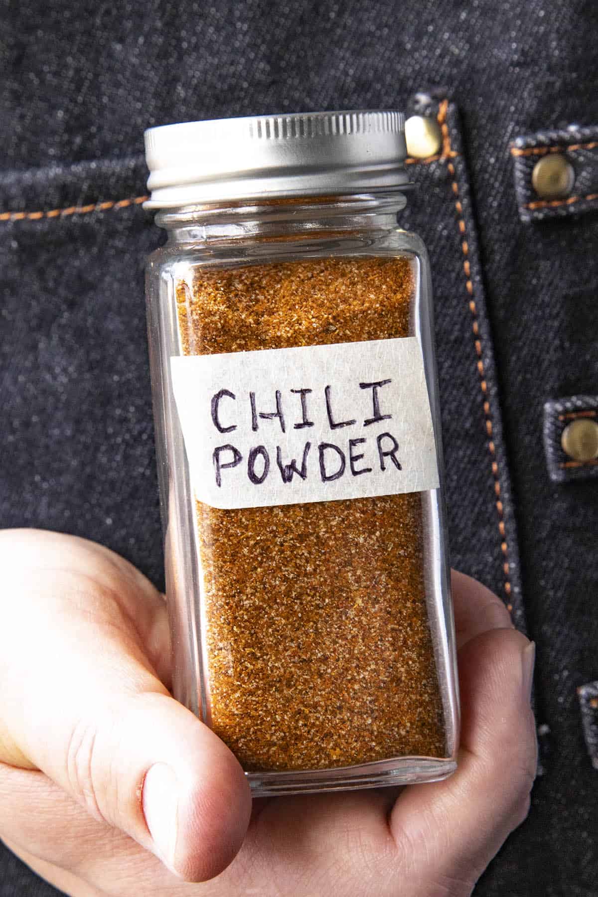 Mike holding a small spice jar of Homemade Chili Powder