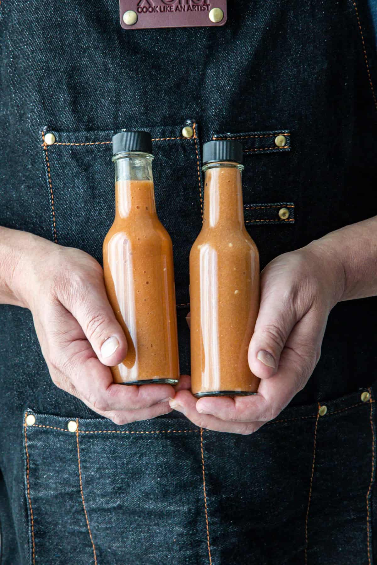 Two bottles of fiery Mango-Habanero hot sauce