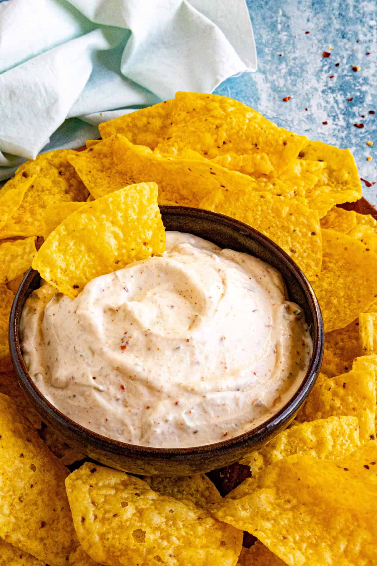 A bowl filled with Mexican White Sauce (Salsa Blanca), surrounded by tortilla chips