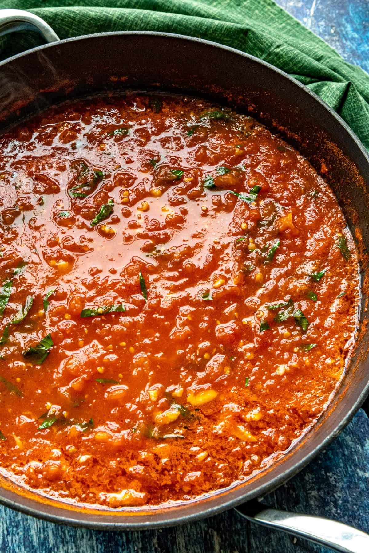 A saucepan simmering with zesty Italian Pomodoro Sauce
