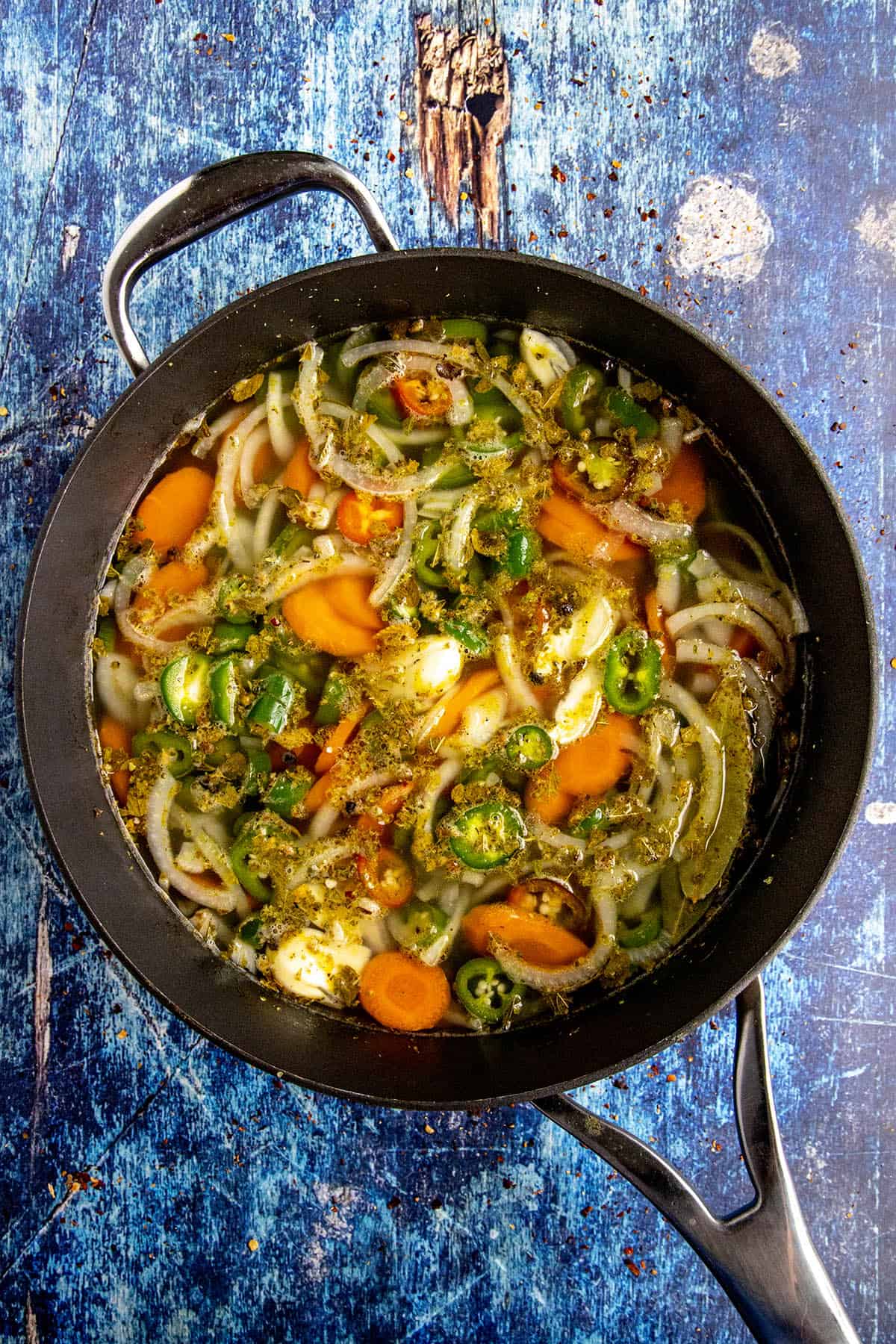 Escabeche (Mexican Pickled Vegetables) simmering in a pot with seasonings