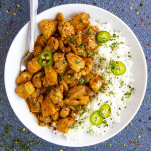 Easy Gochujang Chicken on a plate served with rice
