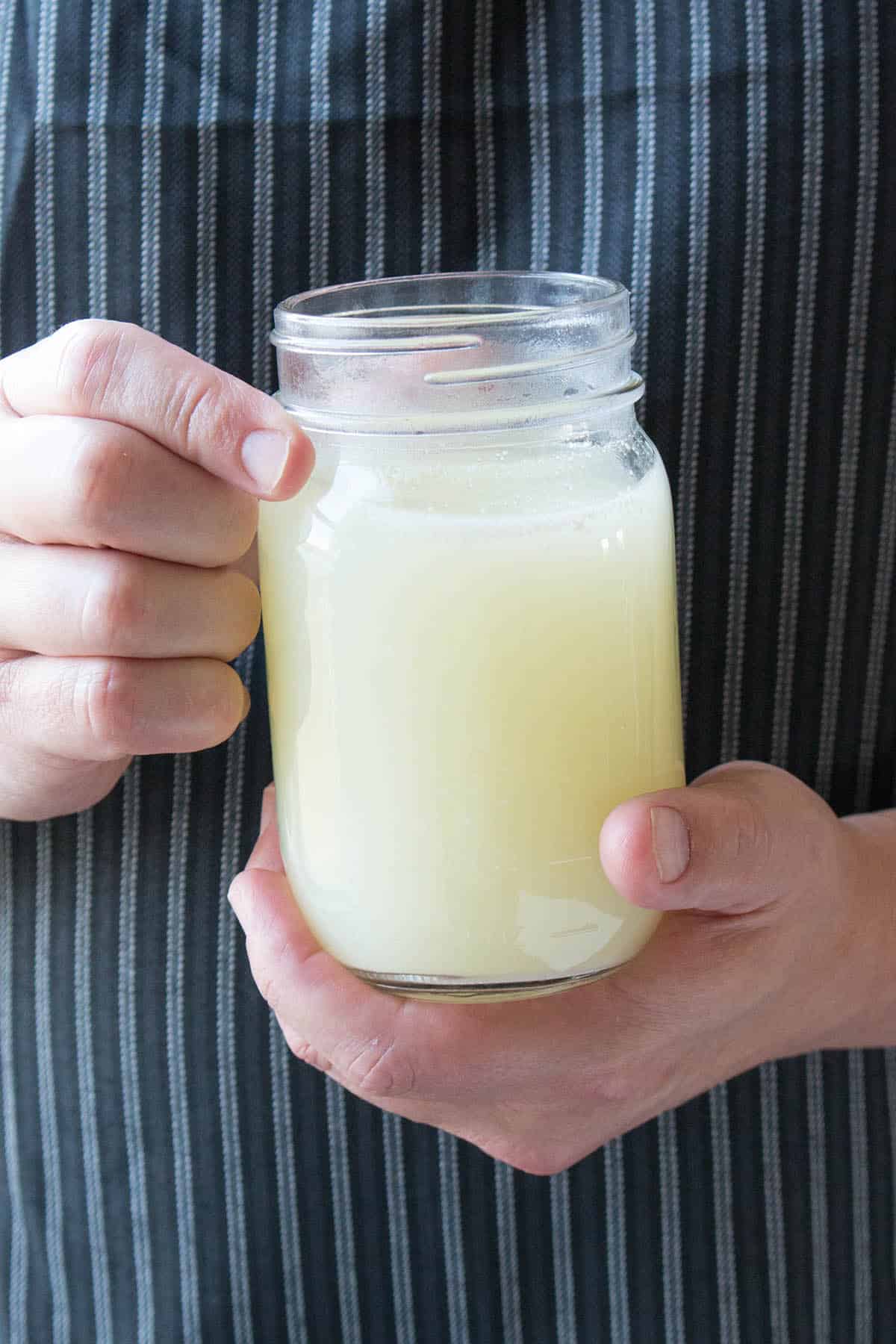 Whey in a jar produced from making Homemade Queso Fresco