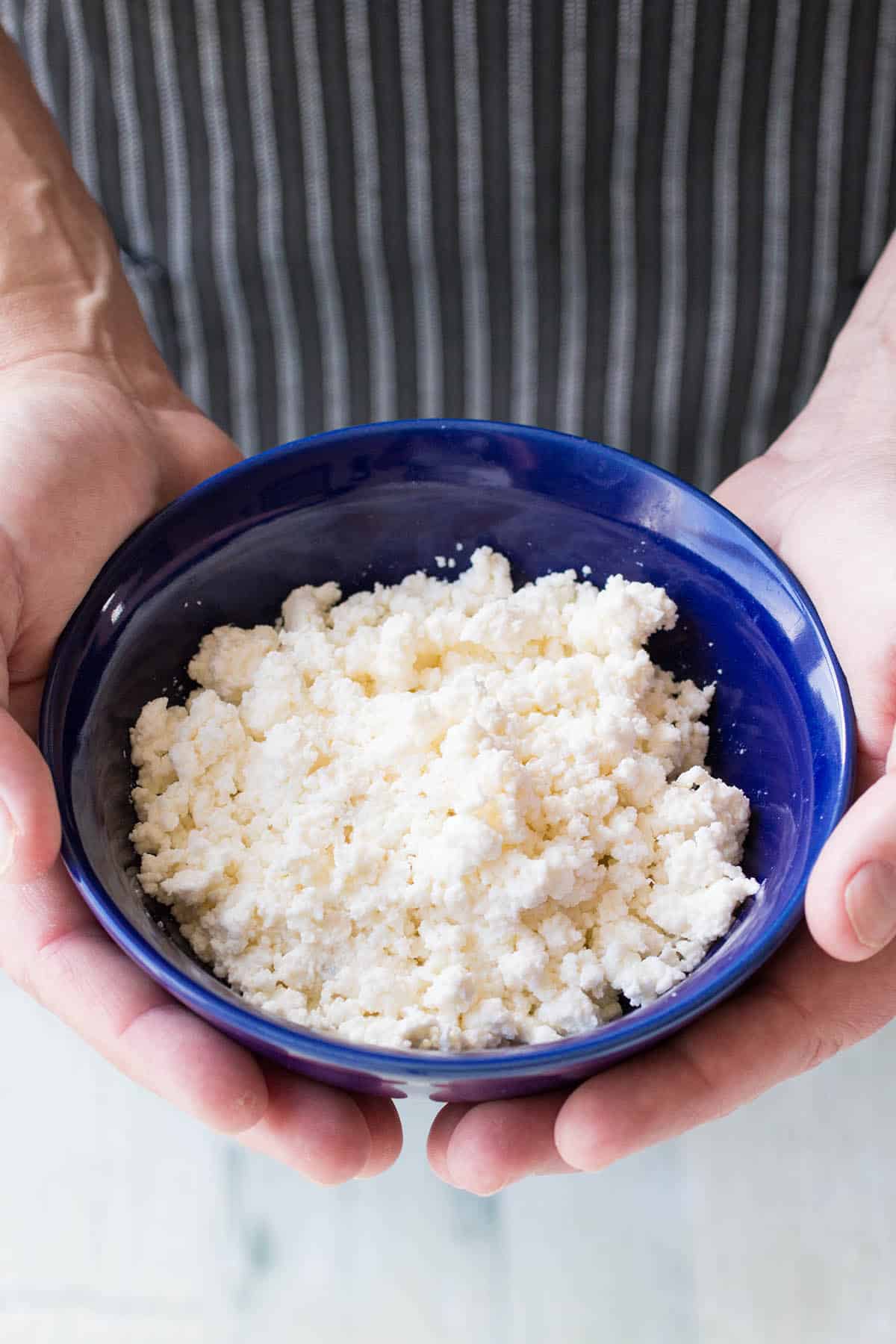 Mike holding a bowl of Homemade Queso Fresco
