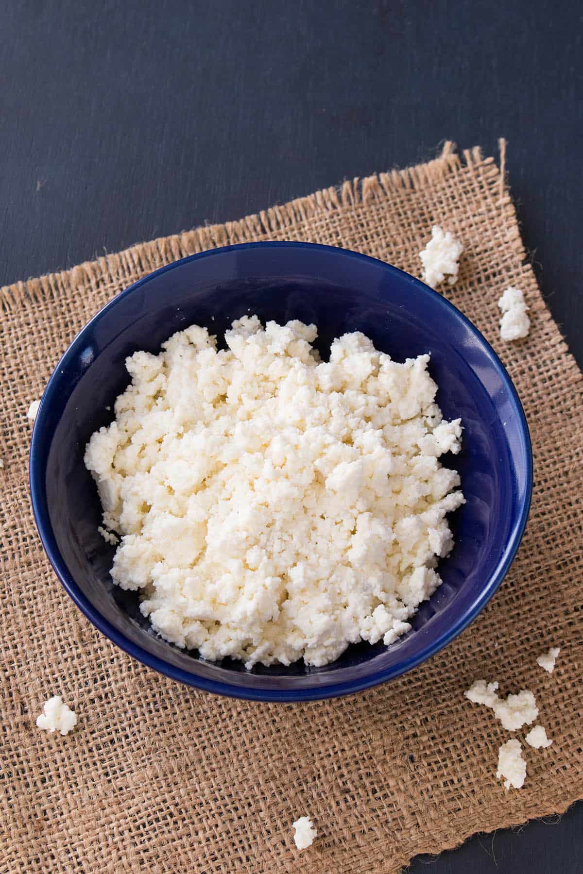 A blue bowl filled with Homemade Queso Fresco
