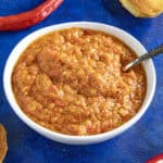Ajvar (Serbian Roasted Red Pepper Relish) in a bowl with a spoon