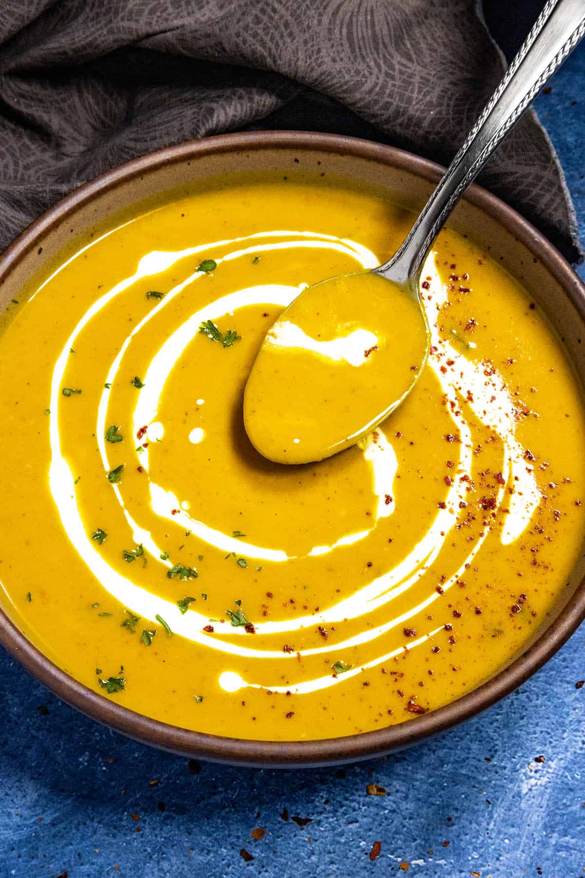 Mike taking a spoonful of Curried Butternut Squash Soup from the bowl