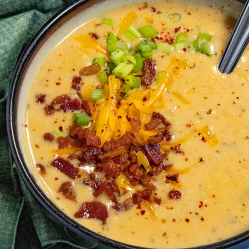 Like a baked potato in a bowl, creamy potato soup garnished with crumbled bacon, chives, and shredded cheddar cheese