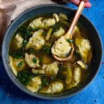 A bowl of Wonton Soup with lots of delicious broth